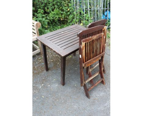 A SMALL GARDEN TABLE WITH TWO CHAIRS, PLUS A SMALL SELECTION OF GARDEN TOOLS