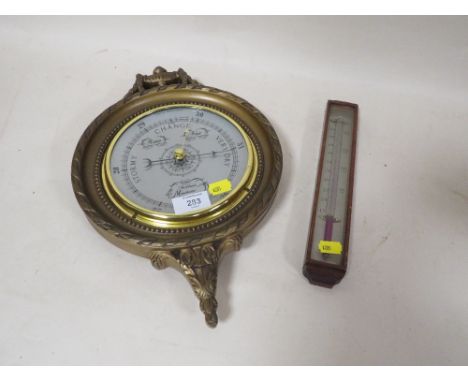 A CIRCULAR WALL MOUNTED BAROMETER TOGETHER WITH A SMALL WOODEN CASED THERMOMETER 