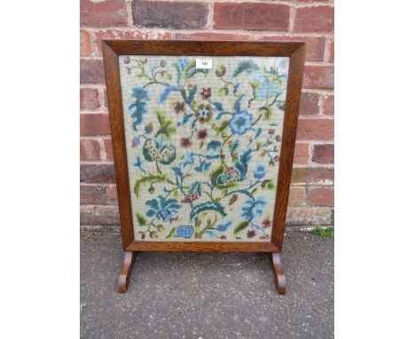 AN OAK GLAZED TAPESTRY FIRESCREEN