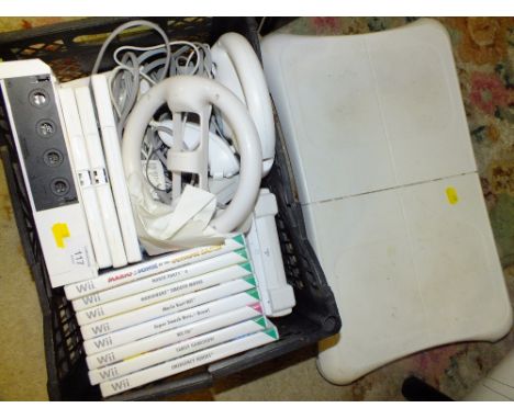 A NINTENDO WII CONSOLE COMPLETE WITH GAMES ETC.