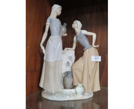 A LARGE NAO FIGURINE OF TWO LADIES COLLECTING WATER, H 39 cm, S/D