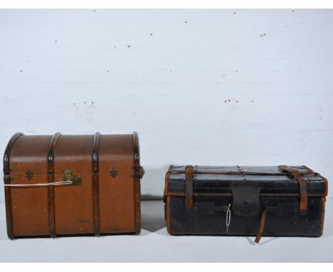 A leather bound travelling trunk and a domed cabin trunk, the leather bound trunk 82cm x 45cm having metal supports to base, 