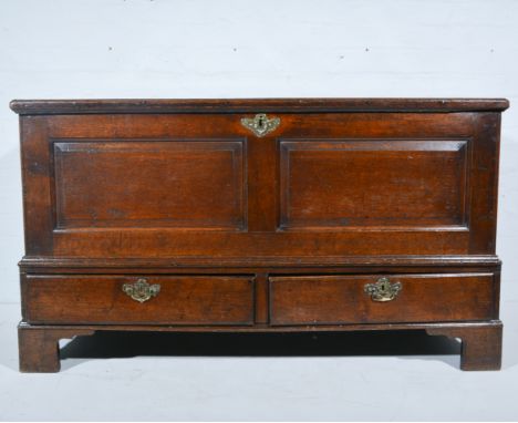 Joined oak mule chest, early 19th century, three panelled hinged lid, twin panelled front abover two drawers, raised on brack
