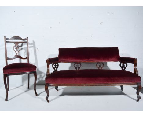 Late Victorian walnut salon suite, comprising a sofa, pair of tub chairs, and four upright chairs.