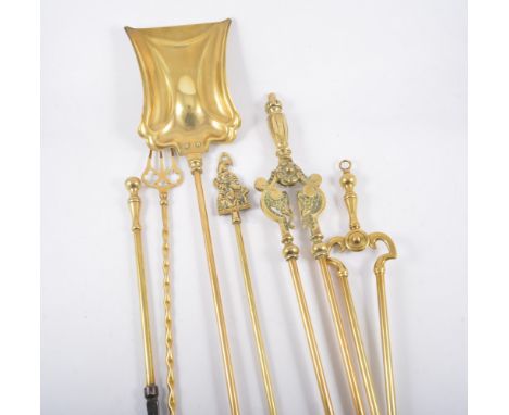 An Art Deco wrought iron firescreen, in the manner of Brandt, 63cm high, width 69cm, together with a quantity of brass fire i
