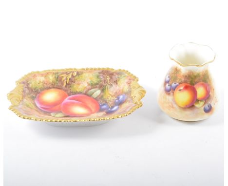 Royal Worcester dish, serpentine gadrooned border with two shell handles, painted with fruit, by John Freeman, 18cm, scratch 