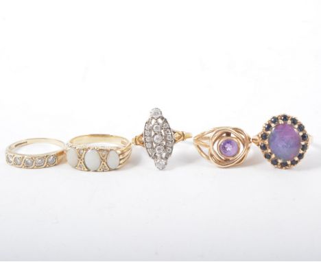 Five dress rings, four hallmarked 9 carat yellow gold and set with opals, opal triplet, amethyst, sapphire and synthetic whit