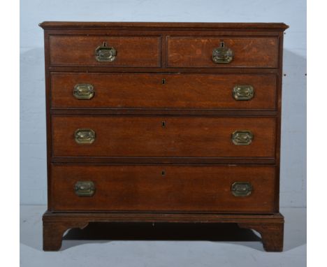 George III oak chest of drawers, rectangular top with a moulded edge, fitted with two short and three long graduating drawers