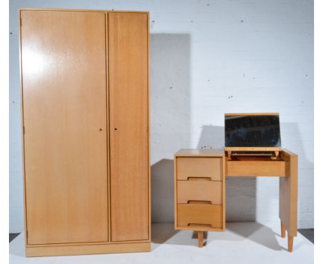 Stag light oak bedroom suite, comprising single wardrobe, desk, bedside table, ottoman.