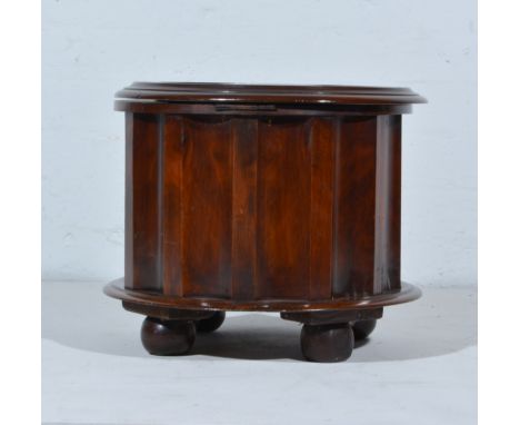 Victorian cylindrical commode, upholstered top within a moulded edge, bun feet, height 36cm.