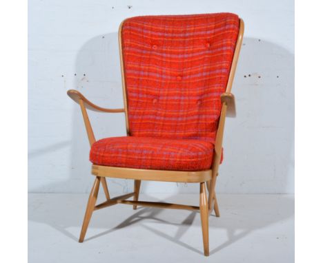 Ercol beech armchair, spindle back, turned legs and rails, loose cushions, width 73cm.