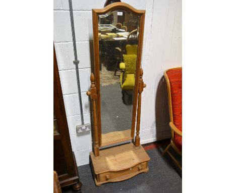 Modern pine cheval mirror, arched bevelled plate, raised on a bow fronted plinth base with drawer, height 165cm,.