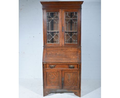 Edwardian oak bureau bookcase, moulded cornice, plain frieze, astragal glazed doors, enclosing two fixed shelves, fall-front 