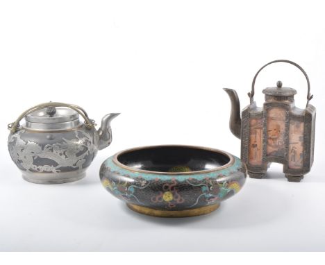 A Japanese overlaid metal tetsubin teapot, another teapot and matching caddy each with three inlaid Japanese scenic panels, a
