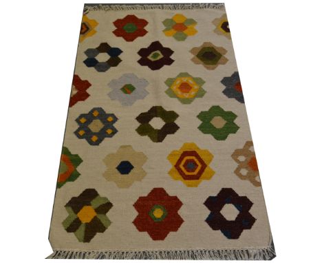 Indian Kilim rug, stylised multi-coloured flower heads against a cream ground, 150 x 90cm.