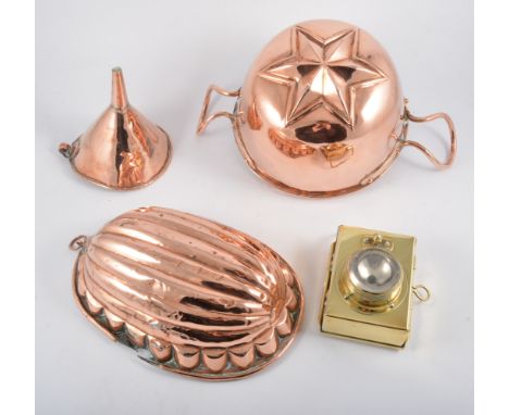 A collection of copper and brass, including oval jellt mould, conical kettle, sieve and a Vogel coffee grinder.