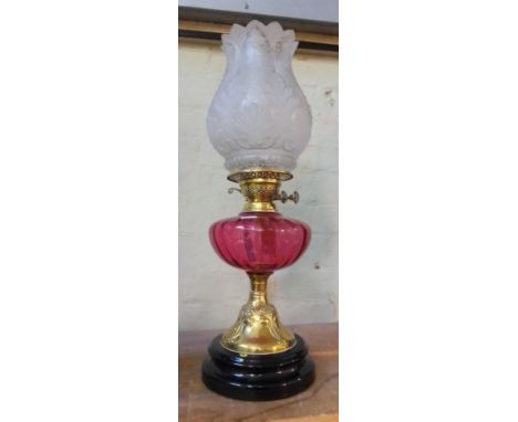 An Art Nouveau pink glass and brass oil lamp with frosted glass shade, height 57cm.Condition:- General wear through age and u