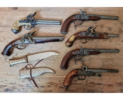 Six assorted replica flintlock pistols & an eastern dagger, one pistol marked 1804, Manufacture Imperiale de St. Etienne, two