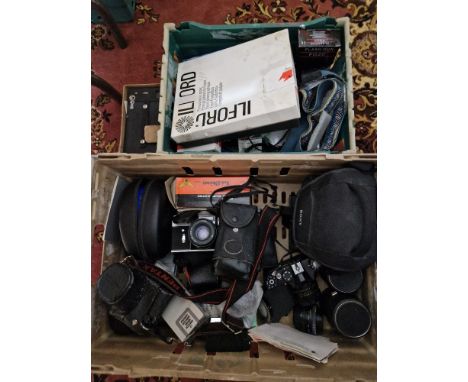 Two boxes of assorted cameras, accessories and a pair of headphones to include Pentax, Zenit x 3, Minolta, Maginon &amp; a Ko