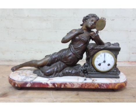 A figural mantle clock, spelter figure, marble base, length 54cm. 