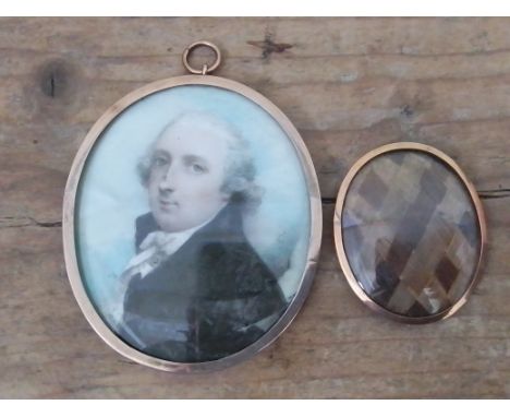 An early 19th century miniature portrait on ivory, yellow metal oval frame, 5.5cm x 6.5cm, together with some plaited hair. E