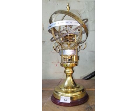 A reproduction orrery clock, attributed to St James House Company London, unmarked, height 41cm.Condition:- General wear thro