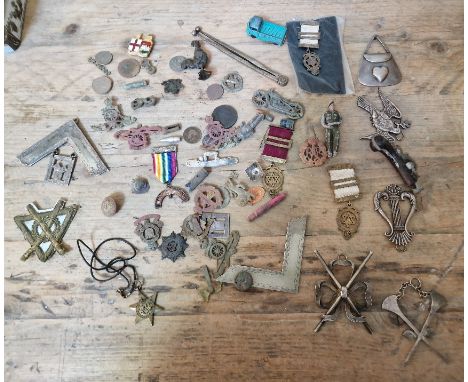 A tin of various military badges / pins, WW2 Star medal, Masonic ware, few toys, etc. 