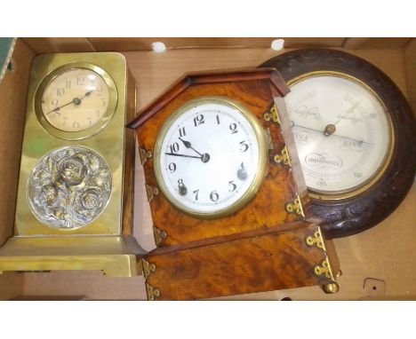 Two clocks and a carved oak framed barometer. 