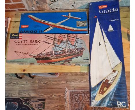 Three unbuilt model kits comprising of a Revell Cutty Sark 1/96 scale, a Graupner 'Gracia' yaught with steel keel r/c &amp; a