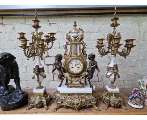 A reproduction clock garniture, tallest measurement 69cm.