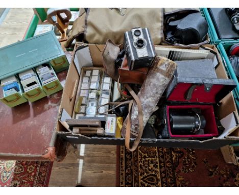 A box of assorted cameras, accessories and 2 cases of various slides to include a Kodak Retinette &amp; the pressman etc.