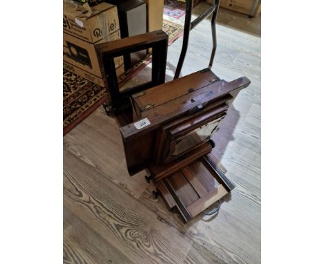 A vintage wooden studio camera, as found.