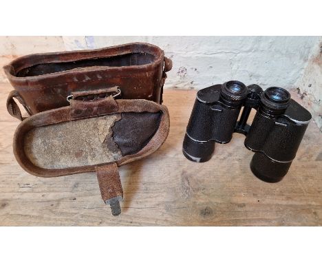 A pair of WW2 Carl Zeiss Jena M 10x50 binoculars in a leather case ( AF ). Missing rubber eye covers.