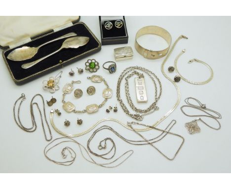 A silver celtic bracelet made by Shipton &amp; Co 1948, a silver ingot pendant, silver conserve spoons and other items Condit