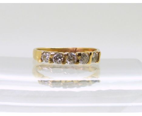 A bright yellow metal five stone diamond ring, set with estimated approx 0.50cts of brilliant cut diamonds, finger size O1/2,