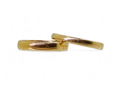 A bright yellow metal wedding ring size N1/2, weight 6.5gms, together with an 18ct gold wedding ring, size R, 4.5gms Conditio