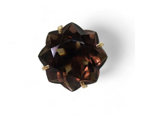 A 9ct gold star cut smokey quartz retro ring, size N, weight 8.2gms Condition Report:Available upon request