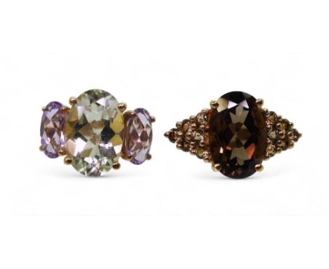 A 9ct gold green and purple amethyst ring, size L. together with a smoky quartz ring, size L1/2, weight combined 5.8gms Condi