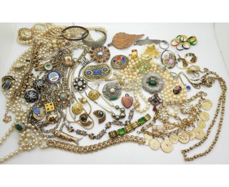 A collection of vintage costume in organiser pouches to include items by Miracle, Exquisite, Czech glass, a Butler &amp; Wils