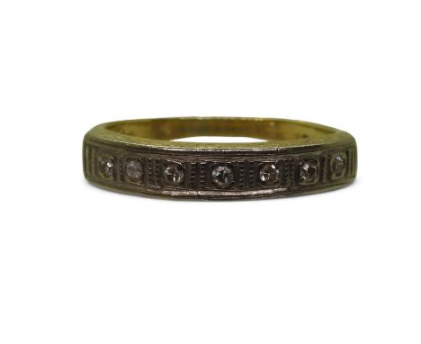 An 18ct gold seven stone diamond ring, set with estimated approx 0.10ctsof brilliant cut diamonds, finger size L, weight 3.6g