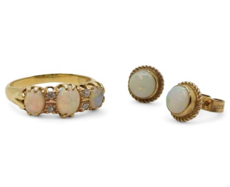 A bright yellow metal opal and diamond ring, set with estimated approx 0.10cts of old cut diamonds, size P, weight 4gms, with