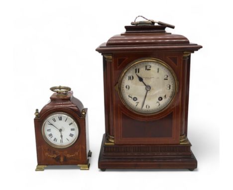An Edwardian Edward and Sons mahogany mantle clock with inlaid detail and another smaller clock Condition Report:Available up