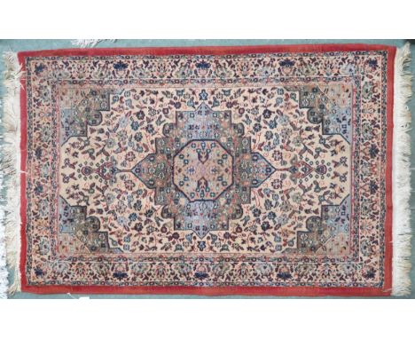 A lot comprising a light blue ground floral patterned Aubusson style rug, 162cm long x 91cm wide and a beige ground Persian s