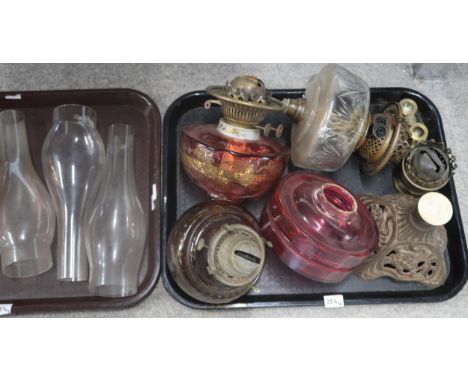 Assorted oil lamp parts including reservoirs, bases and a shade Condition Report:No condition report available.