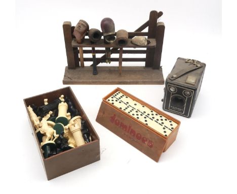 A smoker's pipe rack modelled as a farm gate (supporting four various pipes and a clay pipe fragment), sets of plastic chessm
