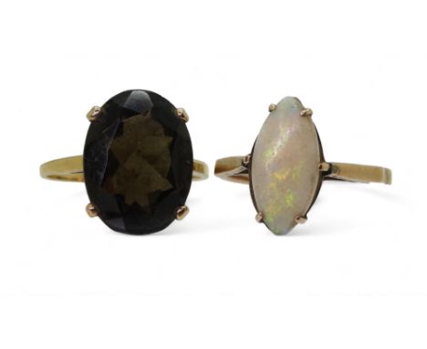 A white opal ring, size P1/2, a 9ct gold smokey quartz ring, size P, weight together 5.7gms Condition Report:Available upon r