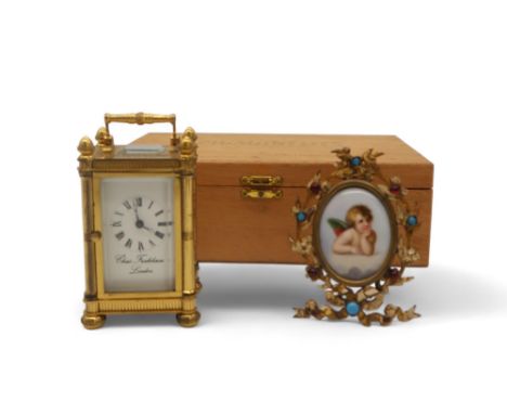 A miniature Chas Frodsham carriage clock together with a Raphael cherub miniature in jewelled frame Condition Report:Availabl