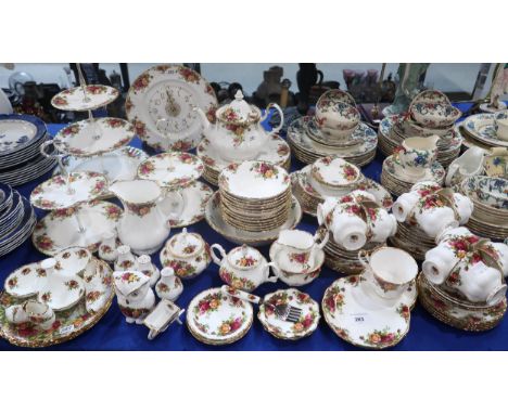 A Royal Albert Old Country Roses tea and dinner service comprising three cake stands, twelve trios, dinner plates, dessert bo