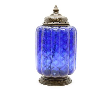 An Indian blue and clear glass cylindrical lantern, with geometric decoration and brass fittings, 33cm high Provenance: From 