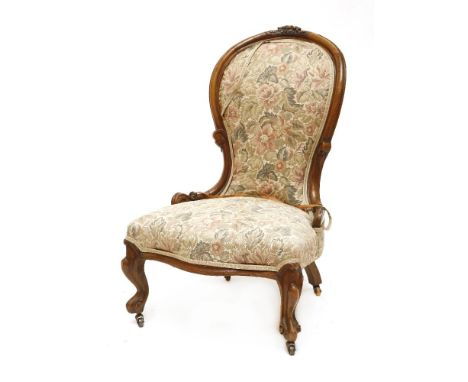 A Victorian mahogany framed nursing chair, on scrolled front legs, together with two mahogany torchères, 20th century, each w